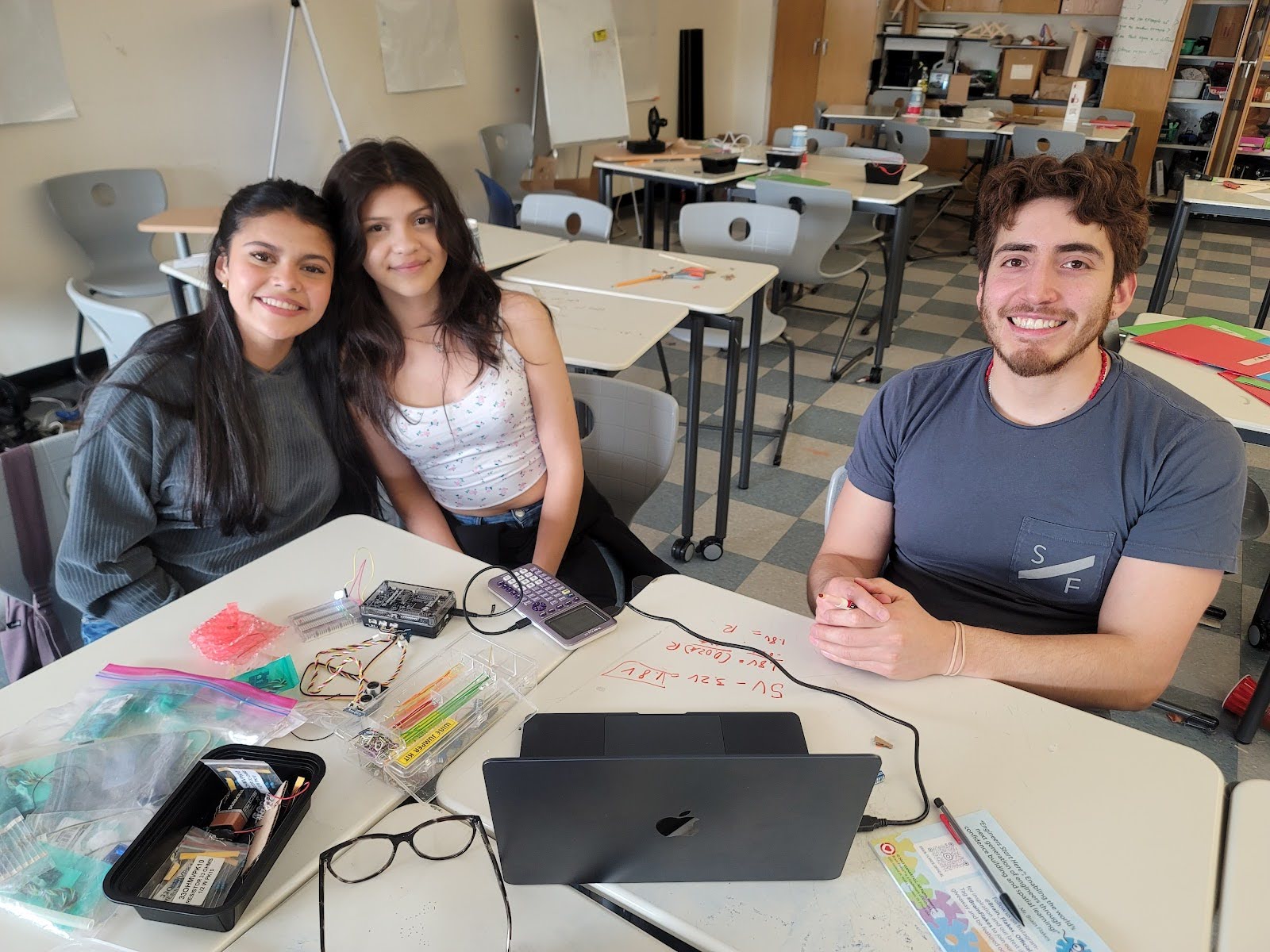 Students on the superbikers design team pictured with their teacher in a CHS classroom